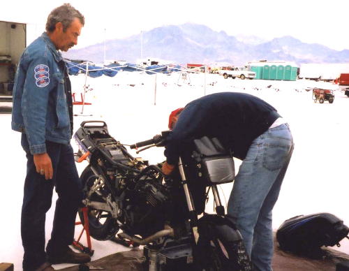 Mike wrenches. Jon watches.